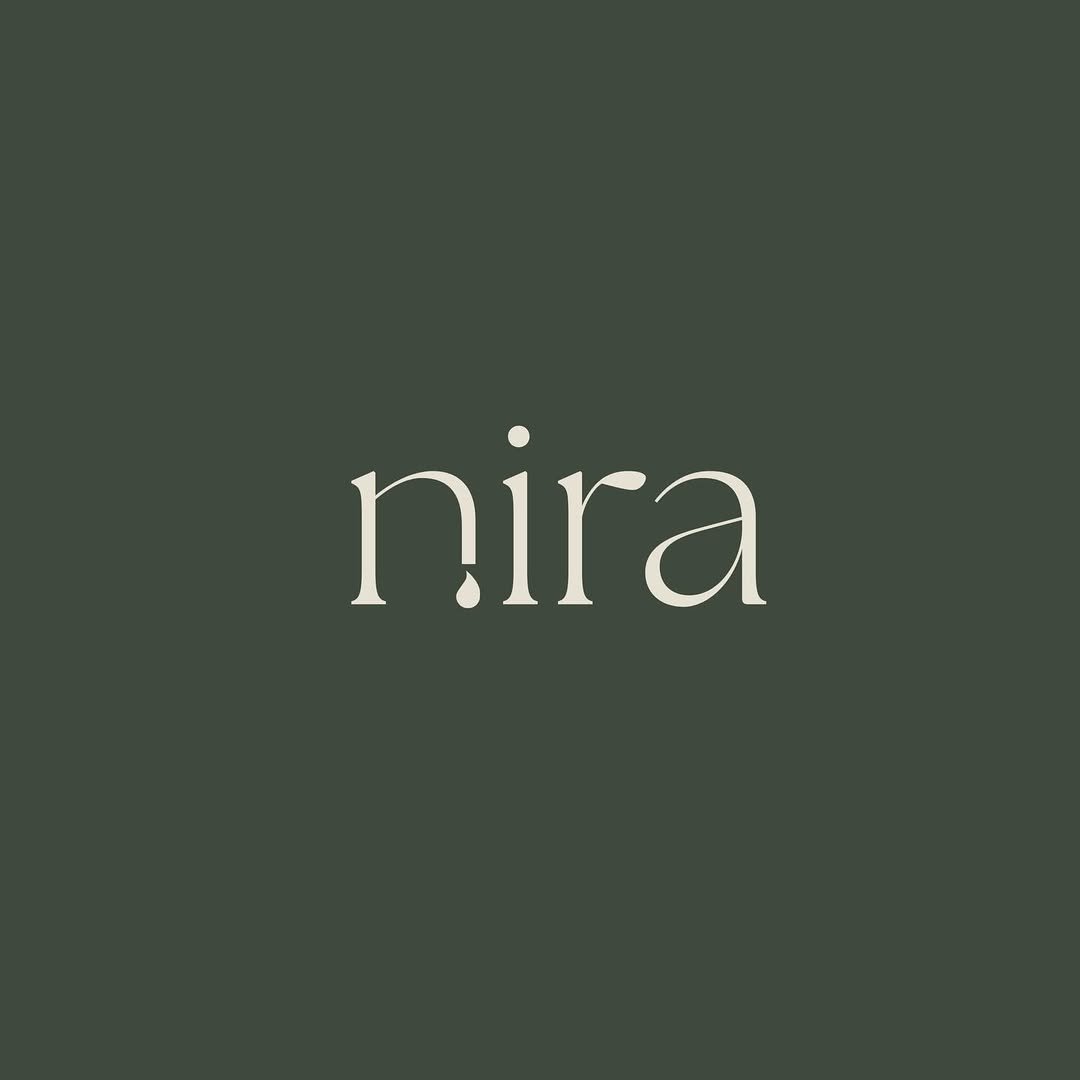 Nira — droplet wordmark in cream against deep sage